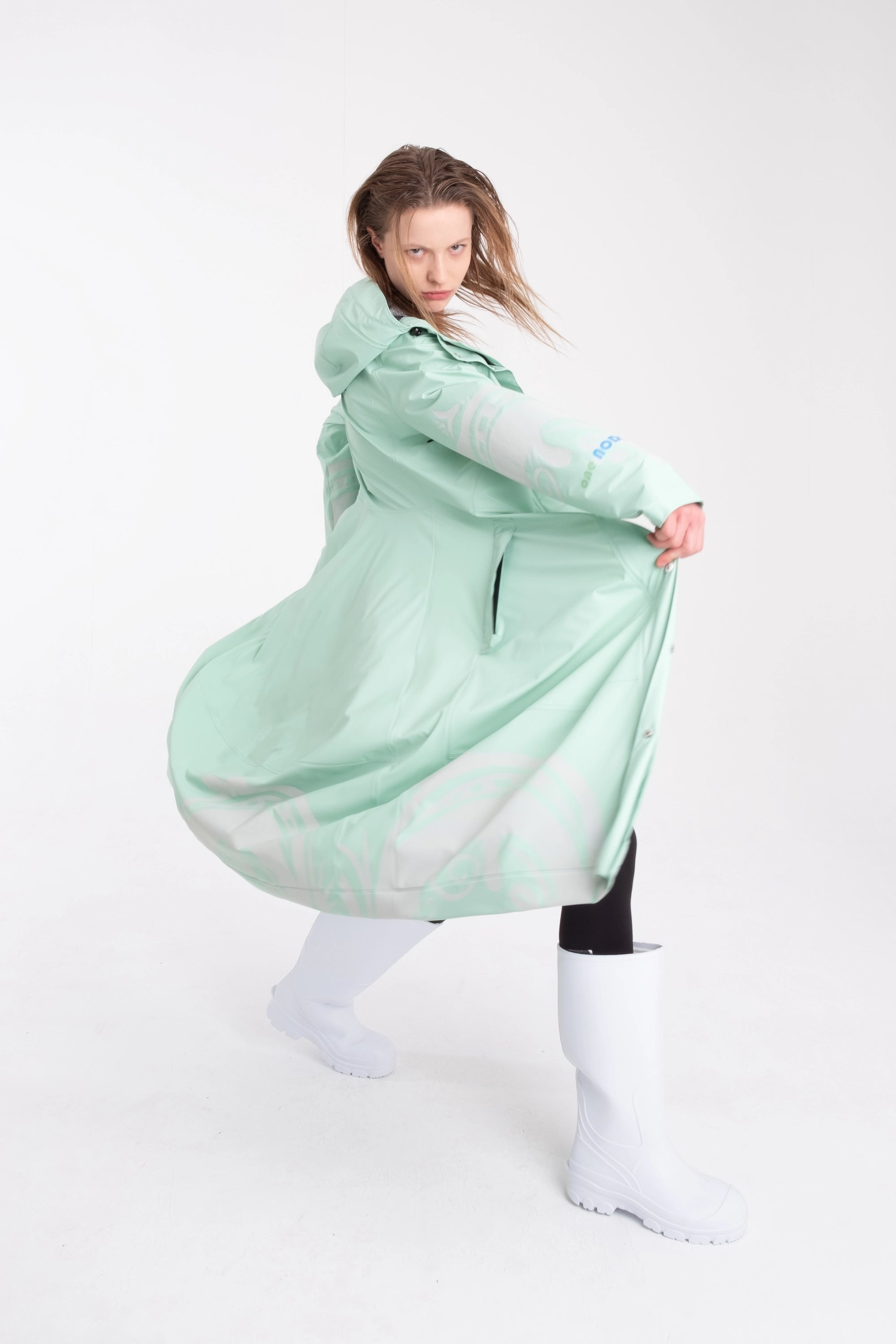 One NODE Scandinavian raincoat Reflex Mint for women – a waterproof and windproof jacket with reflective details for enhanced visibility, designed for all-weather protection