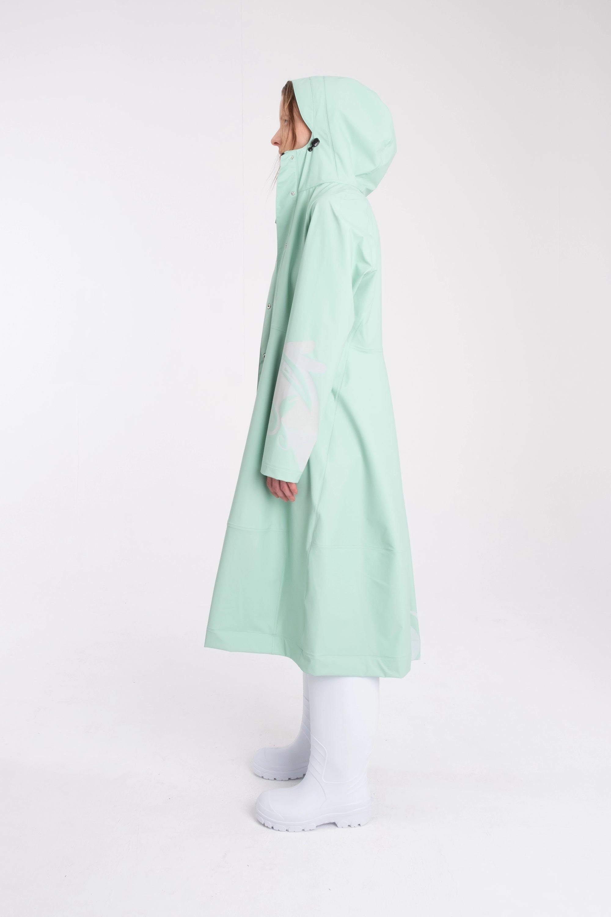 One NODE Scandinavian raincoat Reflex Mint for women – a waterproof and windproof jacket with reflective details for enhanced visibility, designed for all-weather protection