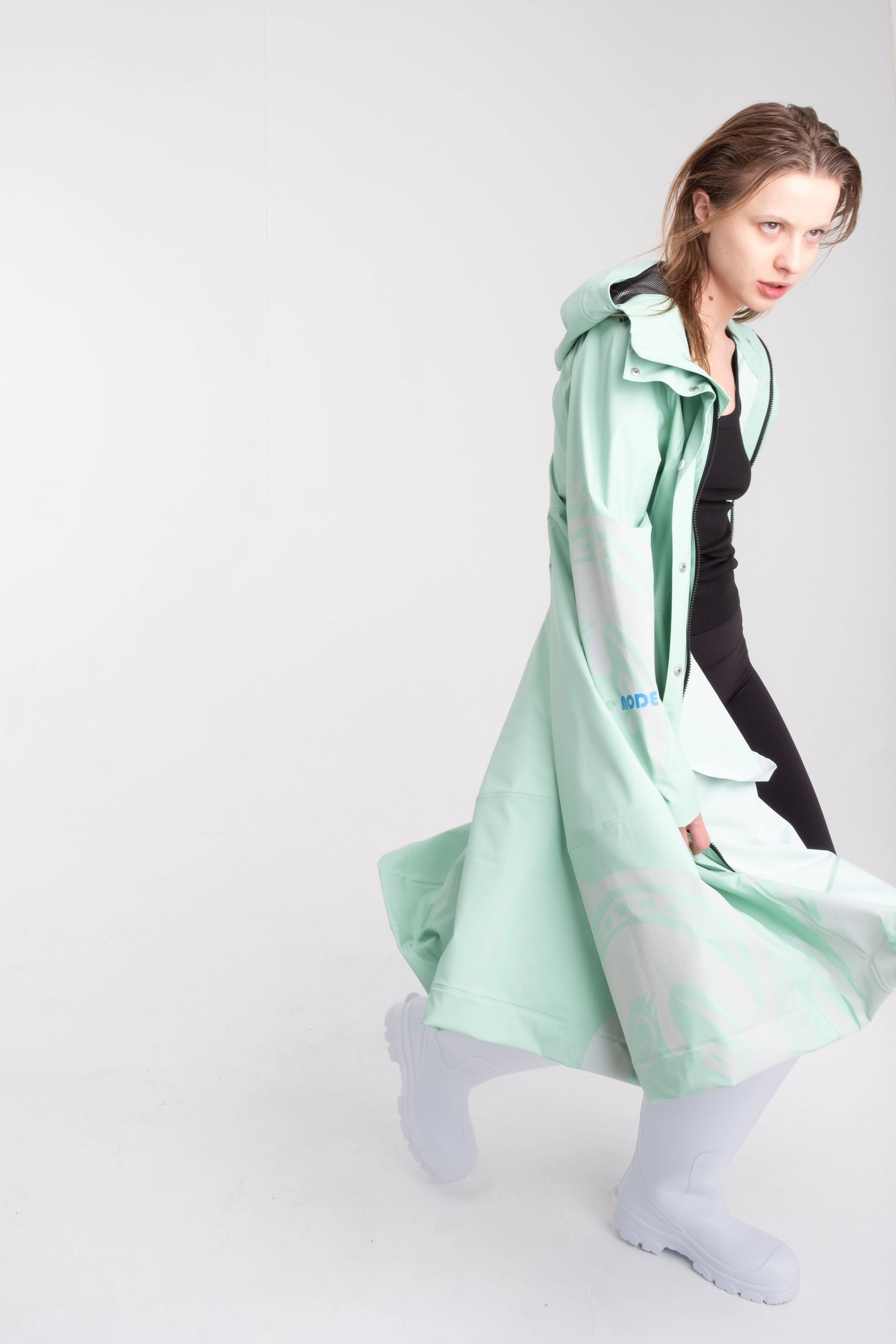 One NODE Scandinavian raincoat Reflex Mint for women – a waterproof and windproof jacket with reflective details for enhanced visibility, designed for all-weather protection