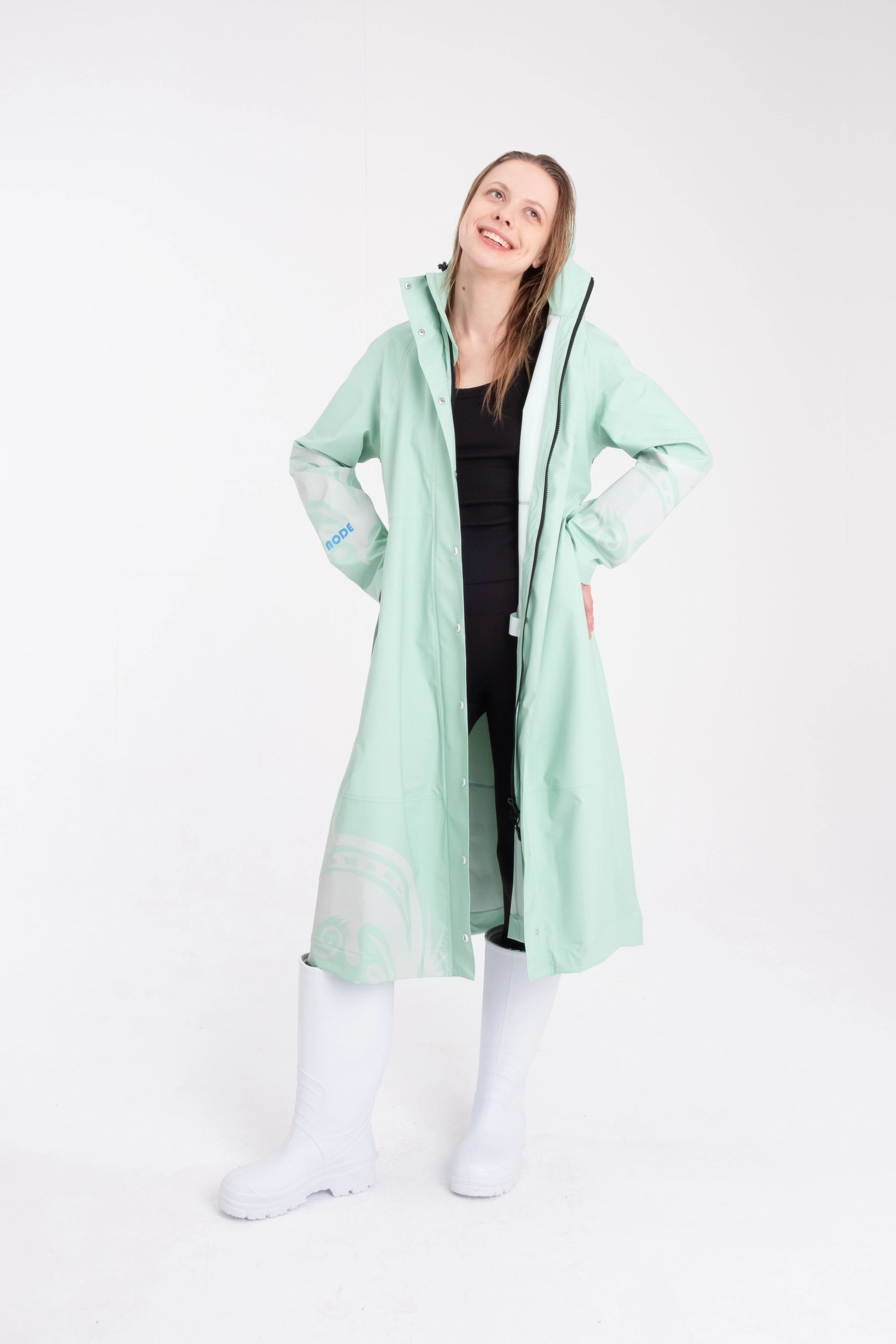 One NODE Scandinavian raincoat Reflex Mint for women – a waterproof and windproof jacket with reflective details for enhanced visibility, designed for all-weather protection